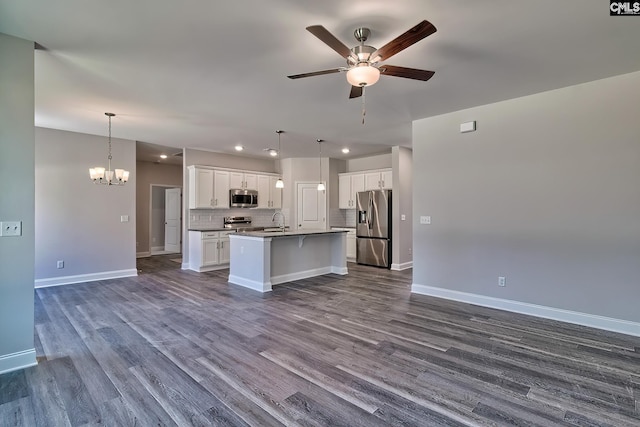 689 W Columbia Ave, Batesburg, SC 29006 - kitchen with appliances with stainless steel finishes, open floor plan, a ceiling fan, a kitchen island with sink, and recessed lighting
