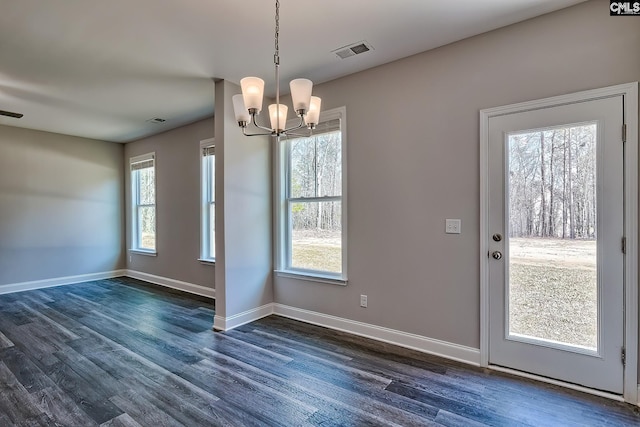 689 W Columbia Ave, Batesburg, SC 29006 - unfurnished dining area with a chandelier and dark wood-style flooring