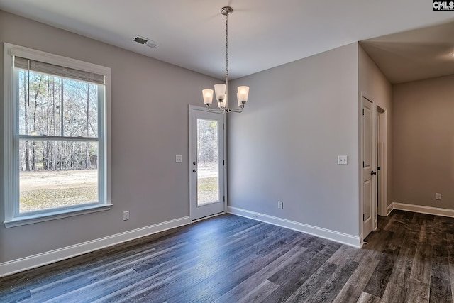 689 W Columbia Ave, Batesburg, SC 29006 - spare room with dark wood-style floors, plenty of natural light, and a chandelier