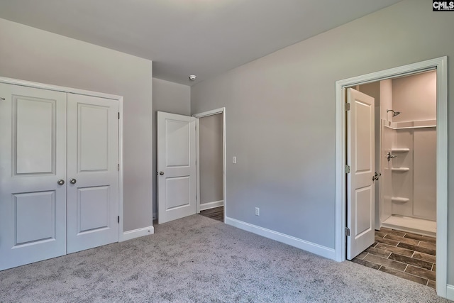 689 W Columbia Ave, Batesburg, SC 29006 - unfurnished bedroom with a closet, dark colored carpet, and ensuite bathroom