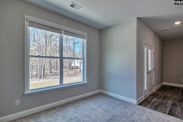 689 W Columbia Ave, Batesburg, SC 29006 - spare room with baseboards and dark colored carpet