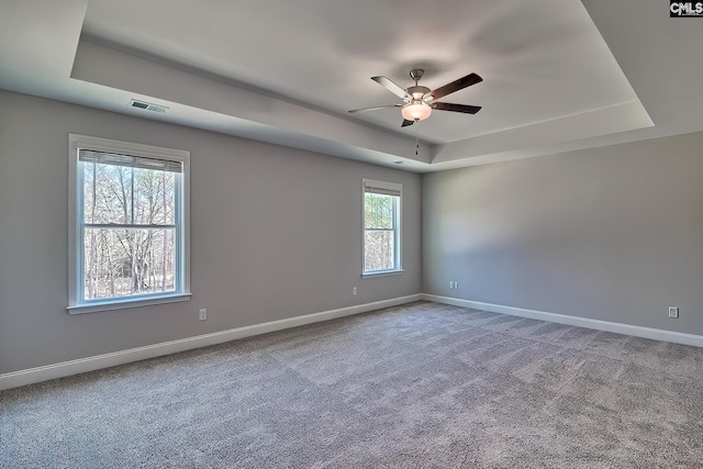 689 W Columbia Ave, Batesburg, SC 29006 - carpeted spare room with a tray ceiling and ceiling fan