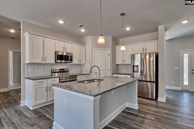 689 W Columbia Ave, Batesburg, SC 29006 - kitchen with stainless steel appliances, white cabinets, dark wood finished floors, and recessed lighting
