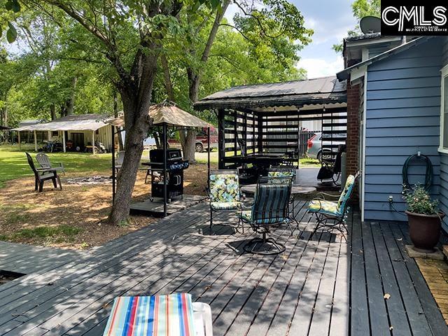 1220 Calhoun St, Newberry, SC 29108 - wooden terrace featuring a gazebo and grilling area