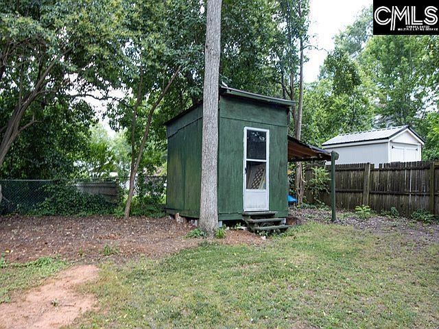 1220 Calhoun St, Newberry, SC 29108 - view of outbuilding featuring entry steps and a fenced backyard