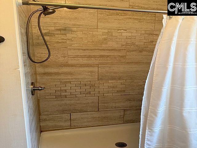 1220 Calhoun St, Newberry, SC 29108 - bathroom featuring a stall shower