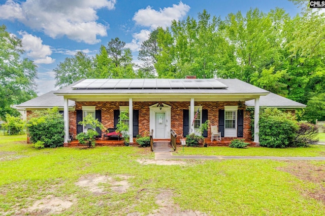 2161 Tanglewood Rd, Sumter, SC 29154 - view of front of home featuring covered porch, a front yard, and brick siding
