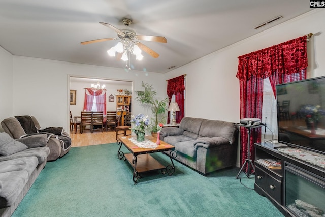 2161 Tanglewood Rd, Sumter, SC 29154 - carpeted living room featuring ceiling fan, a chandelier, and ornamental molding