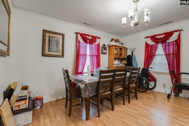 2161 Tanglewood Rd, Sumter, SC 29154 - dining area featuring a chandelier, wood finished floors, and crown molding