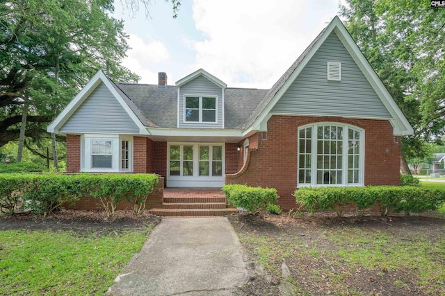 318 Summerland Ave, Batesburg, SC 29006 - view of front of home with a chimney, brick siding, and a shingled roof