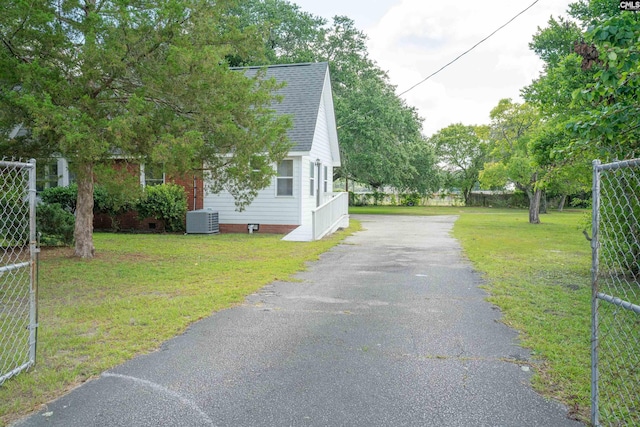 318 Summerland Ave, Batesburg, SC 29006 - view of property exterior with asphalt driveway, a shingled roof, and crawl space