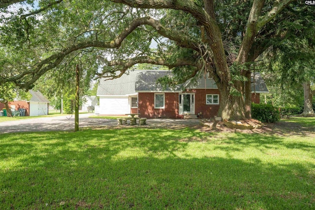 318 Summerland Ave, Batesburg, SC 29006 - view of front facade with a front yard, brick siding, driveway, and roof with shingles