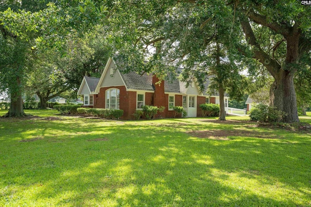 318 Summerland Ave, Batesburg, SC 29006 - view of front of home featuring brick siding, a front yard, and roof with shingles