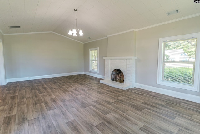 318 Summerland Ave, Batesburg, SC 29006 - unfurnished living room with a chandelier, wood finished floors, ornamental molding, a fireplace, and vaulted ceiling