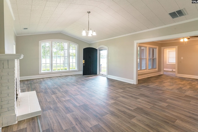 318 Summerland Ave, Batesburg, SC 29006 - unfurnished living room with arched walkways, a chandelier, dark wood-style floors, crown molding, and lofted ceiling