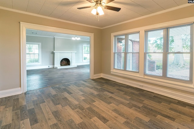 318 Summerland Ave, Batesburg, SC 29006 - unfurnished living room with dark wood-style flooring, a ceiling fan, a brick fireplace, and ornamental molding
