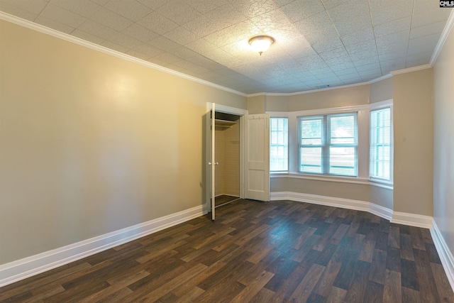 318 Summerland Ave, Batesburg, SC 29006 - unfurnished bedroom featuring dark wood-type flooring, ornamental molding, and a closet