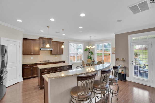 769 Broad Leaf Rd, Elgin, SC 29045 - kitchen with a kitchen island with sink, wood finished floors, appliances with stainless steel finishes, plenty of natural light, and recessed lighting