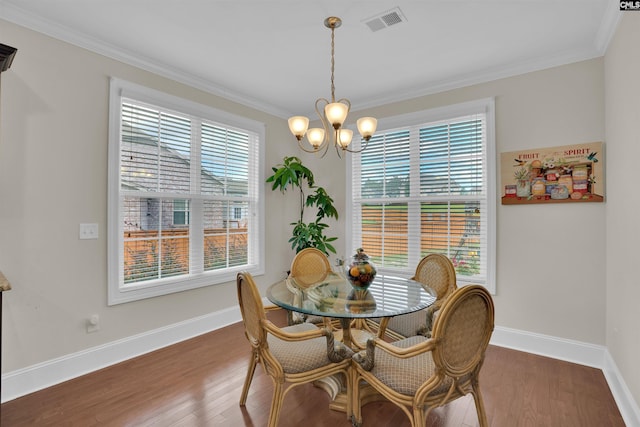 769 Broad Leaf Rd, Elgin, SC 29045 - dining room with ornamental molding, wood finished floors, and a chandelier