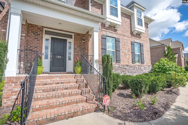 769 Broad Leaf Rd, Elgin, SC 29045 - doorway to property featuring brick siding and covered porch
