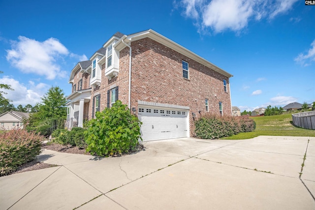 769 Broad Leaf Rd, Elgin, SC 29045 - view of home's exterior with concrete driveway, brick siding, and an attached garage