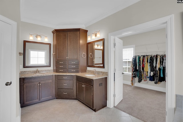 769 Broad Leaf Rd, Elgin, SC 29045 - bathroom featuring double vanity, a walk in closet, ornamental molding, and tile patterned floors