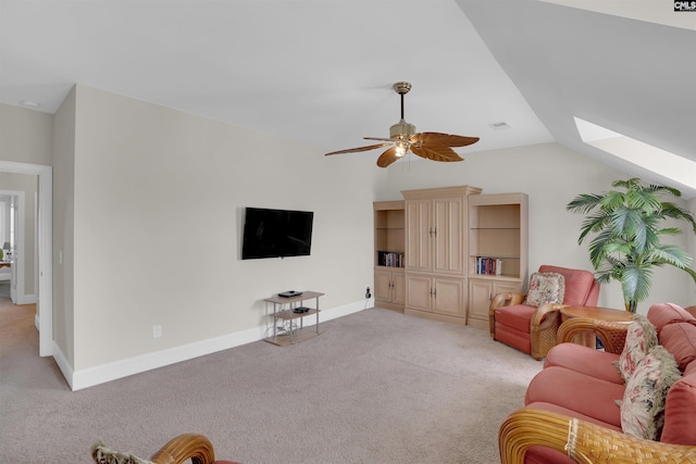 769 Broad Leaf Rd, Elgin, SC 29045 - living room featuring light colored carpet, a skylight, ceiling fan, and vaulted ceiling