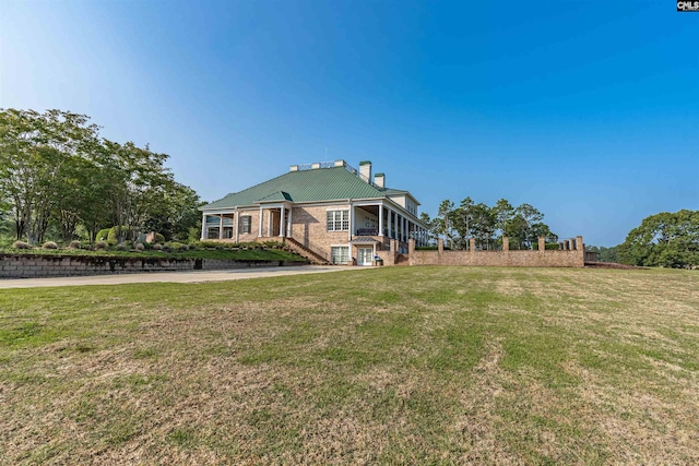 769 Broad Leaf Rd, Elgin, SC 29045 - rear view of house featuring a chimney and a yard
