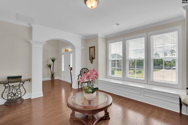 769 Broad Leaf Rd, Elgin, SC 29045 - sitting room with arched walkways, ornate columns, ornamental molding, and wood finished floors