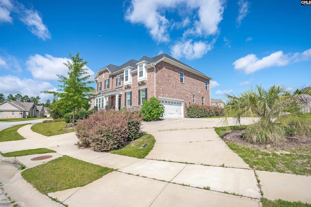 769 Broad Leaf Rd, Elgin, SC 29045 - view of front facade featuring brick siding, an attached garage, and concrete driveway