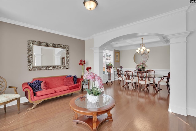 769 Broad Leaf Rd, Elgin, SC 29045 - living area with ornate columns, arched walkways, wood finished floors, crown molding, and a chandelier