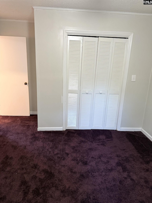 113 Brookland Cir, Columbia, SC 29204 - unfurnished bedroom with dark colored carpet, a closet, and ornamental molding