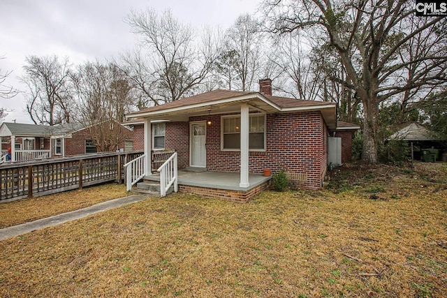 113 Brookland Cir, Columbia, SC 29204 - bungalow-style home with a chimney, brick siding, and a front lawn