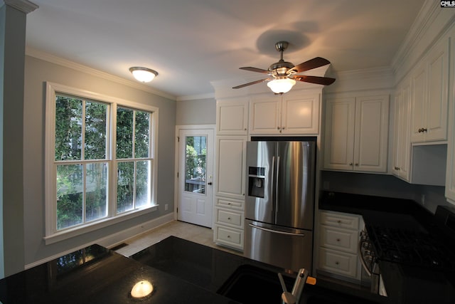 392 Highland Point Dr, Columbia, SC 29229 - kitchen with appliances with stainless steel finishes, white cabinets, dark countertops, ceiling fan, and ornamental molding
