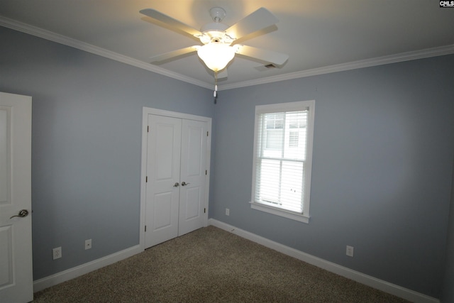 392 Highland Point Dr, Columbia, SC 29229 - unfurnished bedroom with crown molding, carpet, a closet, and a ceiling fan