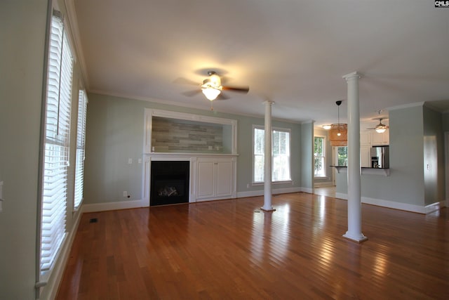 392 Highland Point Dr, Columbia, SC 29229 - unfurnished living room featuring a ceiling fan, decorative columns, a fireplace, ornamental molding, and wood finished floors