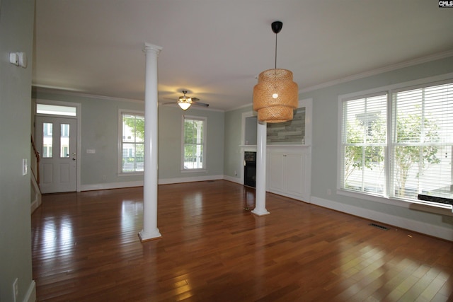 392 Highland Point Dr, Columbia, SC 29229 - unfurnished living room with decorative columns, hardwood / wood-style flooring, ornamental molding, a ceiling fan, and a fireplace