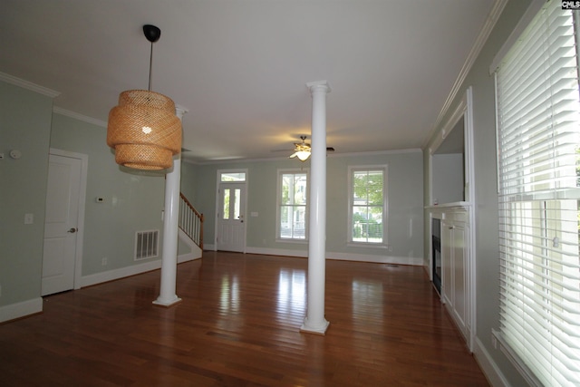 392 Highland Point Dr, Columbia, SC 29229 - unfurnished living room with ornate columns, ornamental molding, stairway, wood finished floors, and healthy amount of natural light