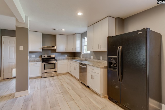 105 Garmony Cir, Columbia, SC 29212 - kitchen featuring stainless steel appliances, under cabinet range hood, white cabinetry, and recessed lighting