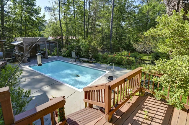 730 Stoneridge Rd, Ridgeway, SC 29130 - swimming pool with a wooden deck, a patio, and view of wooded area