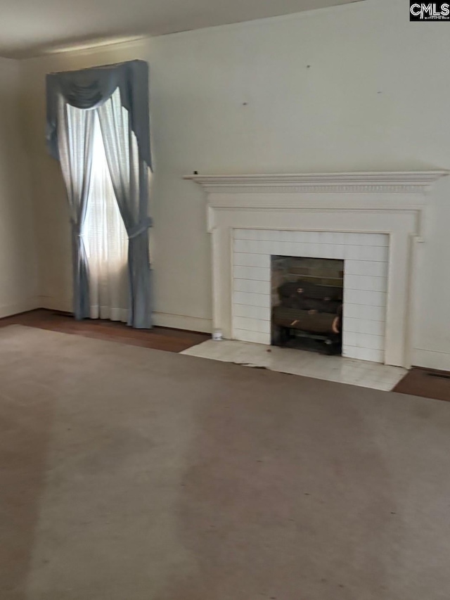 209 E Columbia Ave, Batesburg, SC 29070 - unfurnished living room featuring a fireplace with flush hearth