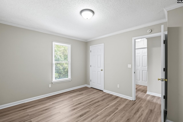 265 Thornhill Rd, Columbia, SC 29212 - unfurnished bedroom featuring light wood-type flooring, ornamental molding, and a textured ceiling