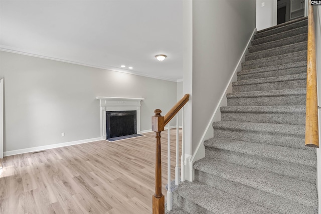 265 Thornhill Rd, Columbia, SC 29212 - stairs with ornamental molding, wood finished floors, a fireplace, and recessed lighting
