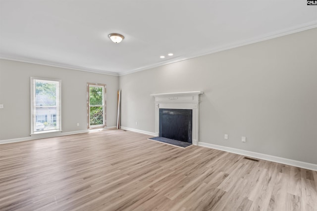 265 Thornhill Rd, Columbia, SC 29212 - unfurnished living room with crown molding, light wood-style flooring, a fireplace with flush hearth, and recessed lighting