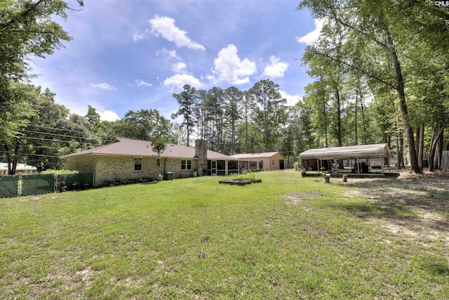 1220 Barnwell Dr, Sumter, SC 29154 - view of yard featuring a carport