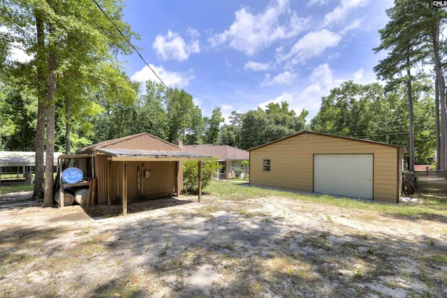 1220 Barnwell Dr, Sumter, SC 29154 - detached garage featuring view of scattered trees
