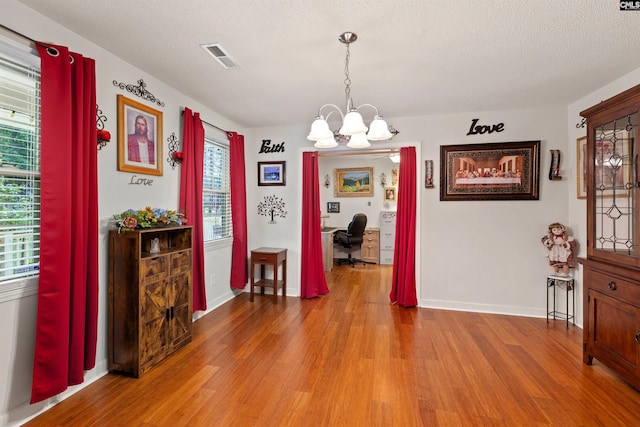 1220 Barnwell Dr, Sumter, SC 29154 - dining room with light wood-style flooring, a chandelier, and an office area