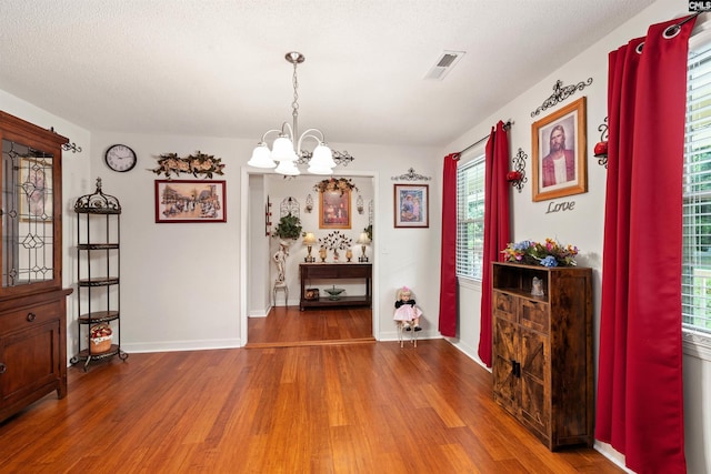 1220 Barnwell Dr, Sumter, SC 29154 - dining room featuring wood finished floors, a chandelier, and plenty of natural light