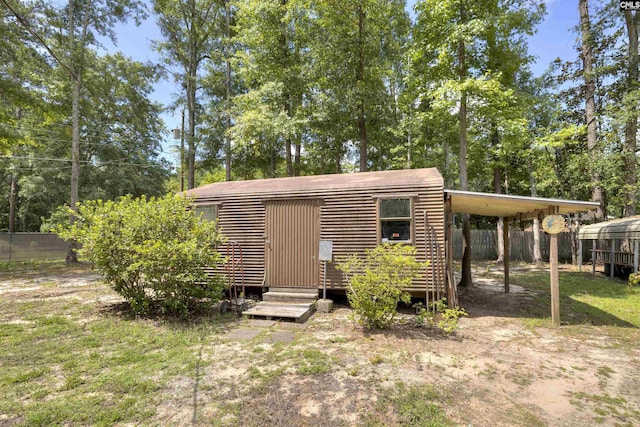 1220 Barnwell Dr, Sumter, SC 29154 - back of property with a carport and view of scattered trees