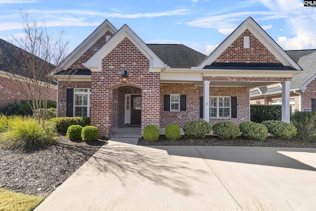 143 Club Ridge Rd, Elgin, SC 29045 - view of front of property featuring brick siding, covered porch, and roof with shingles